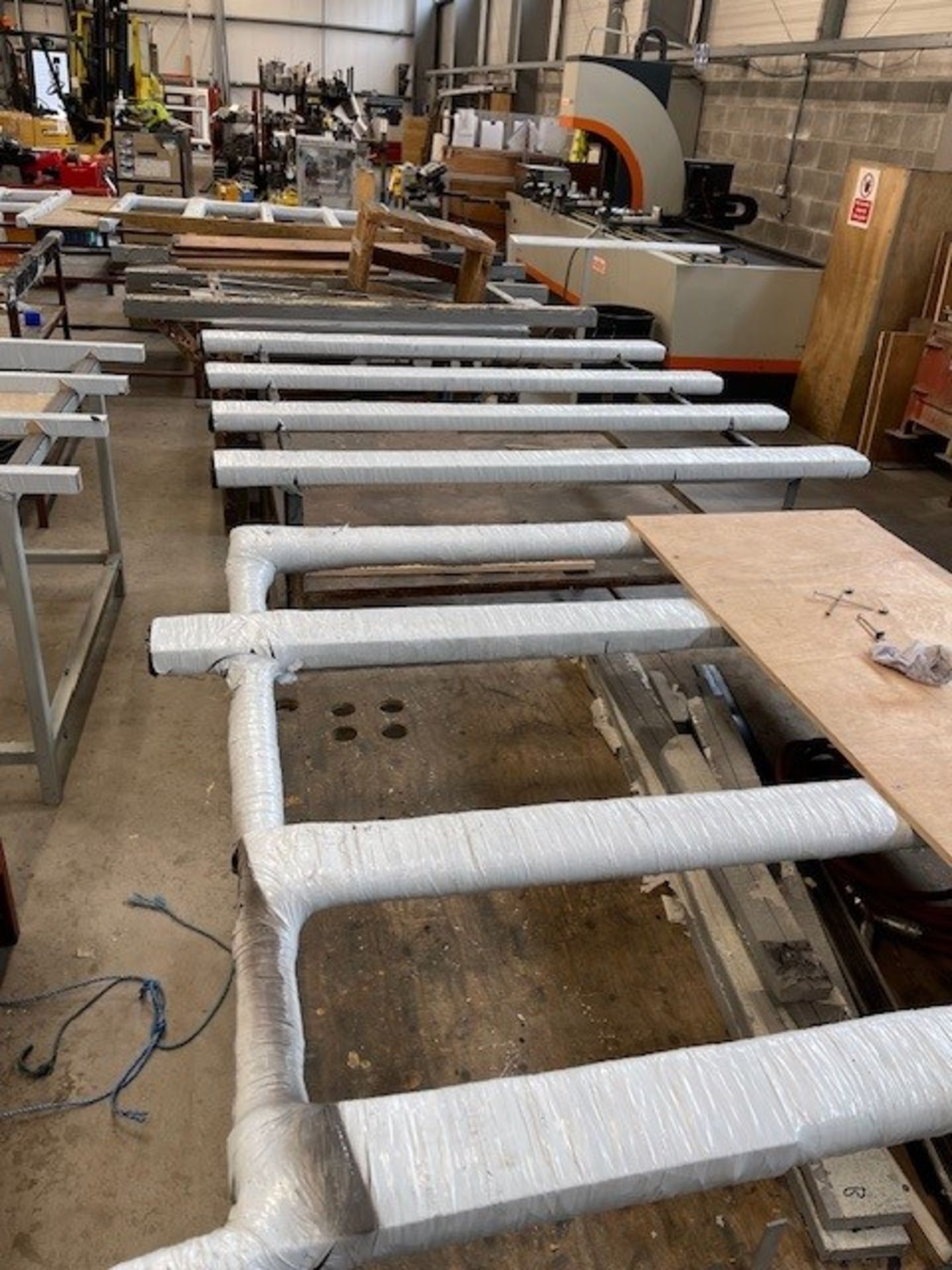 Five various steel frame workbenches