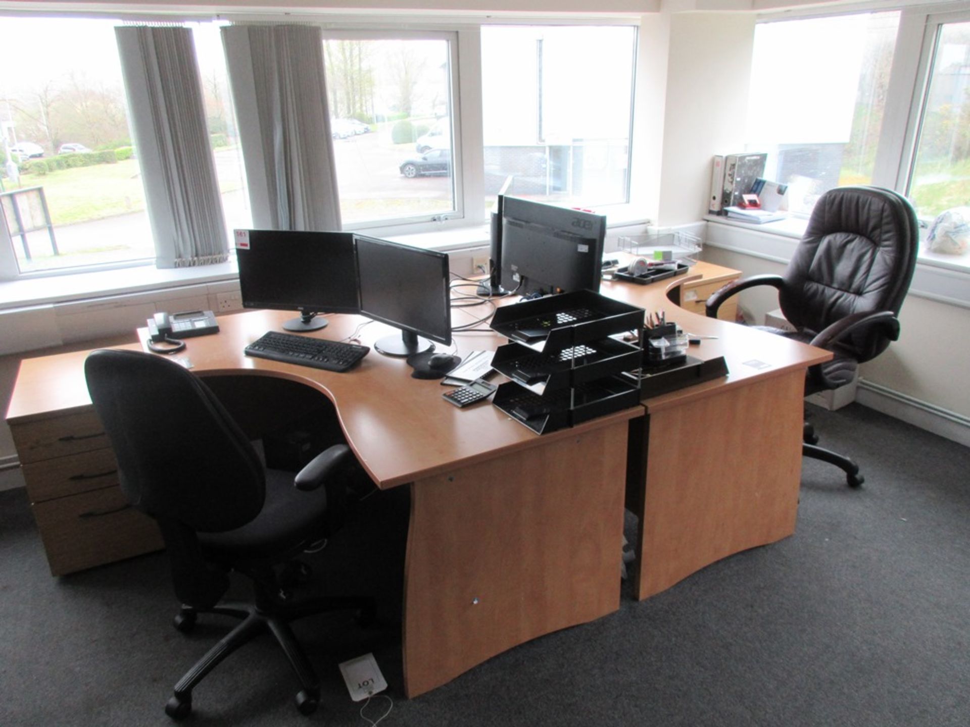 Two light wood 'L' shaped laminate desks