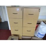 Two light wood 4-drawer filing cabinets