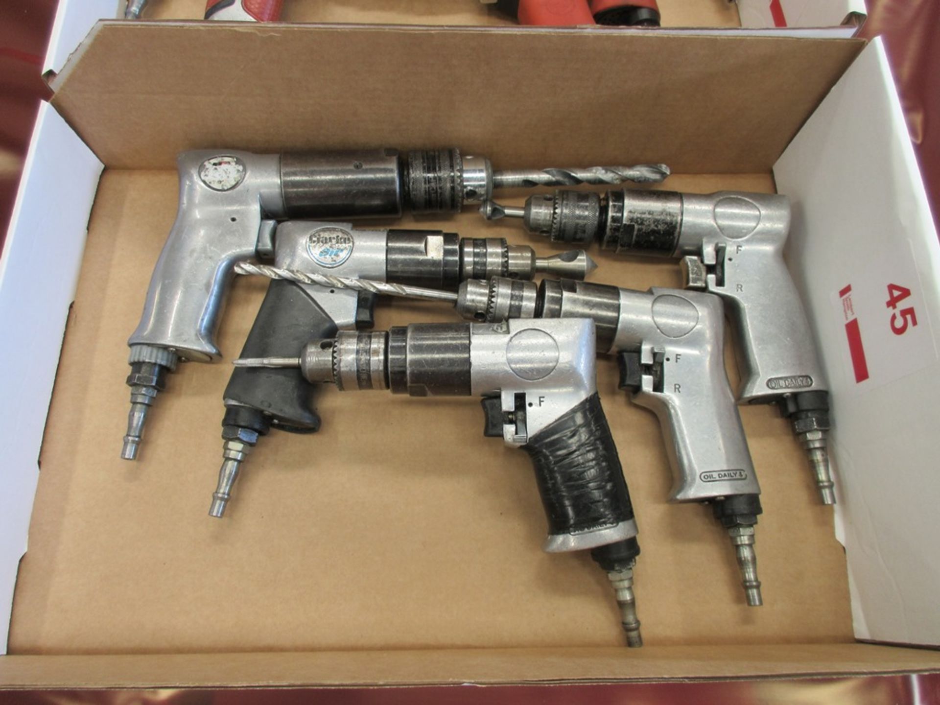 Five assorted pneumatic pistol grip drills
