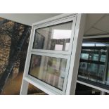 Aluminium framed twin push out door showroom window