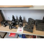 Eight pieces of various tooling on one shelf