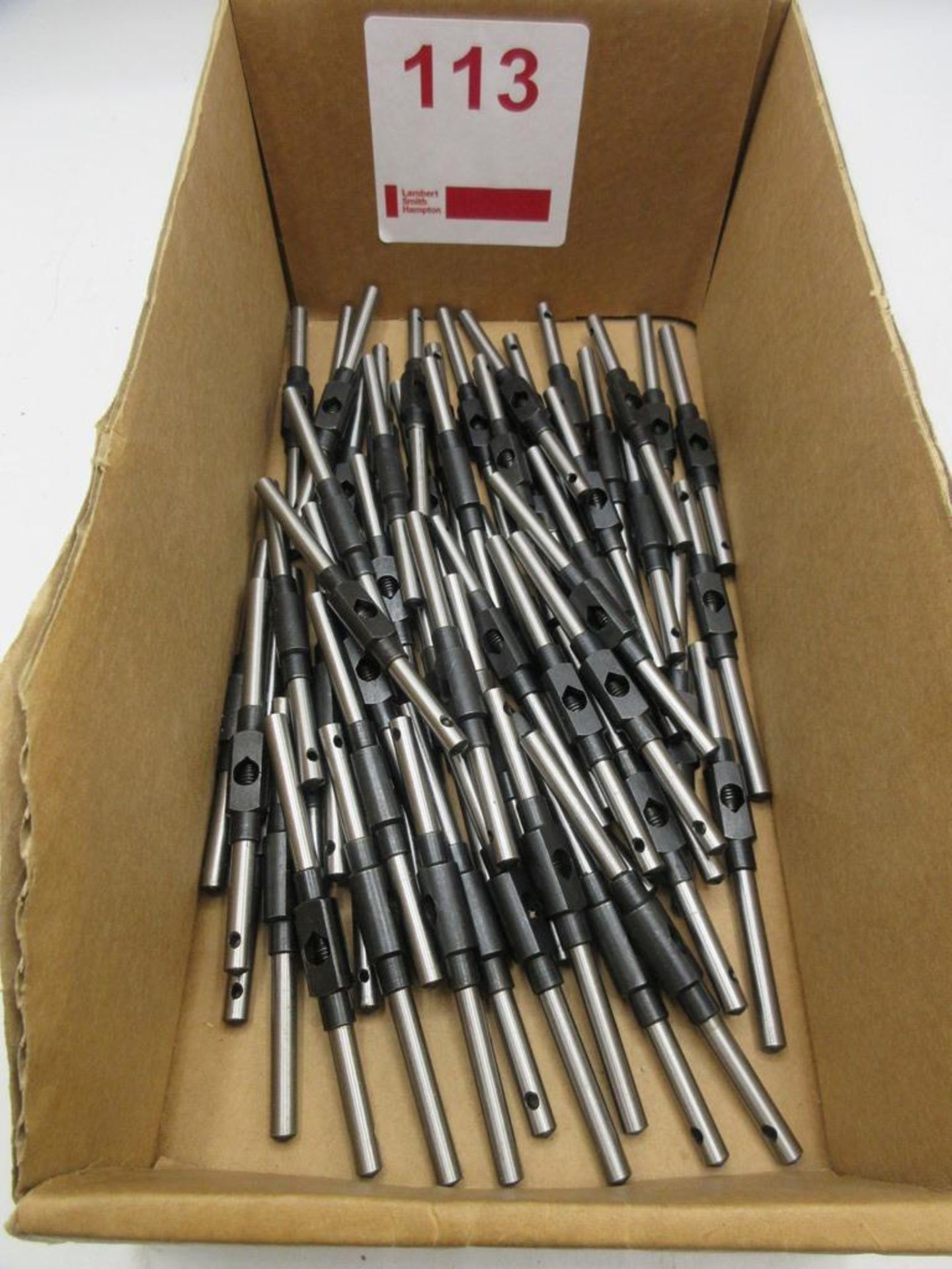 Sixty small tap wrenches