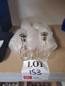 Assortment of glass screw top decanters