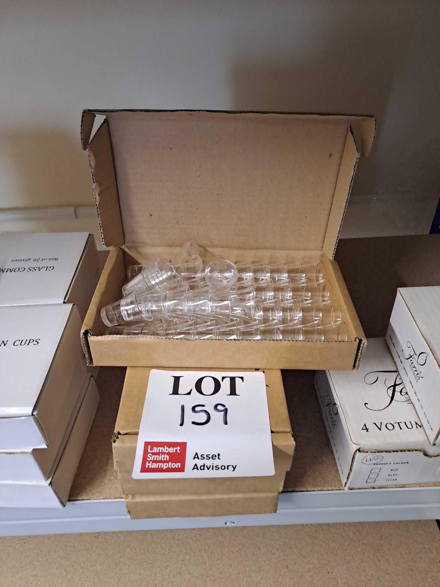 Eight boxes of plastic communion cups