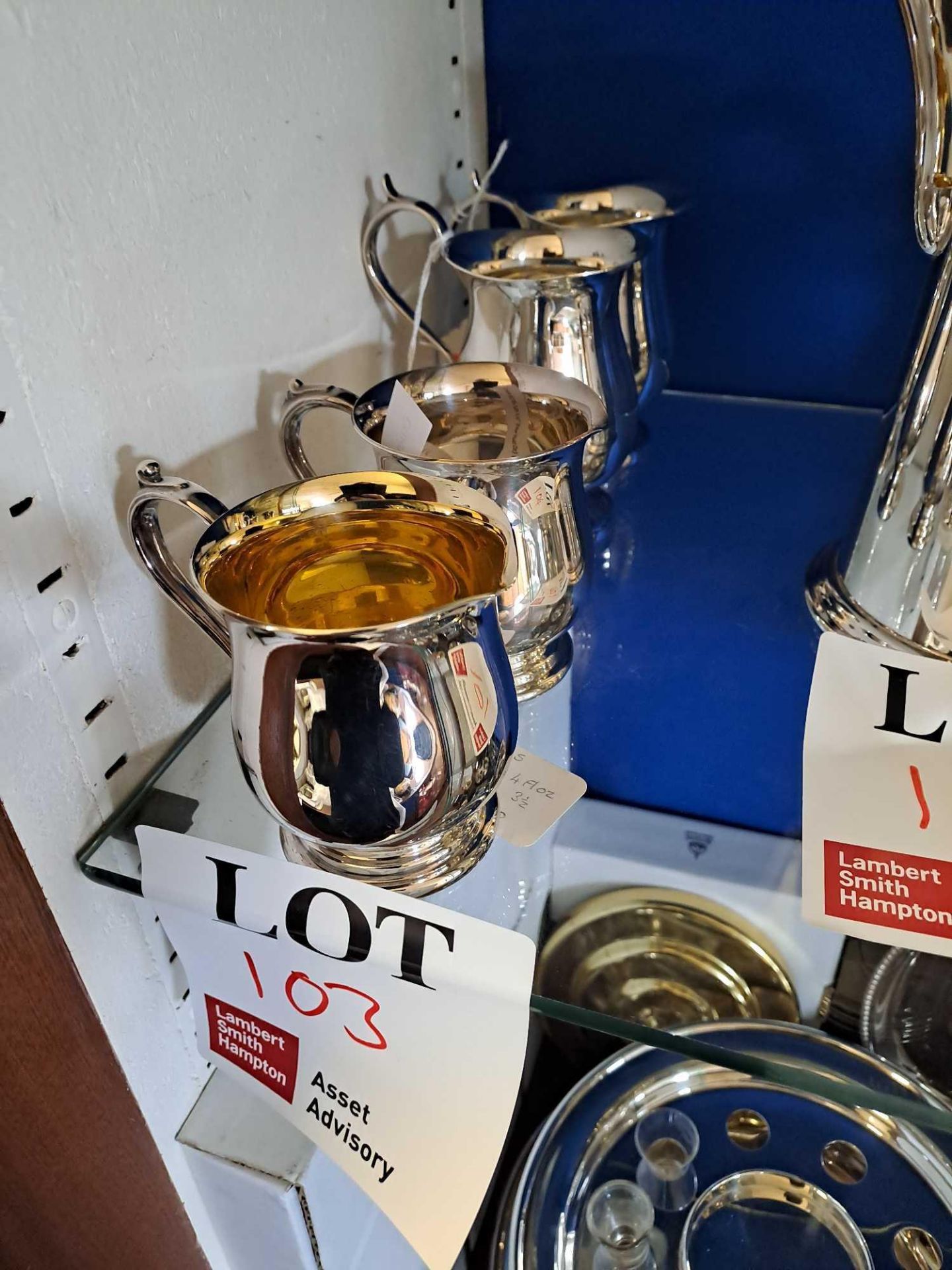 Four silver plated small jugs