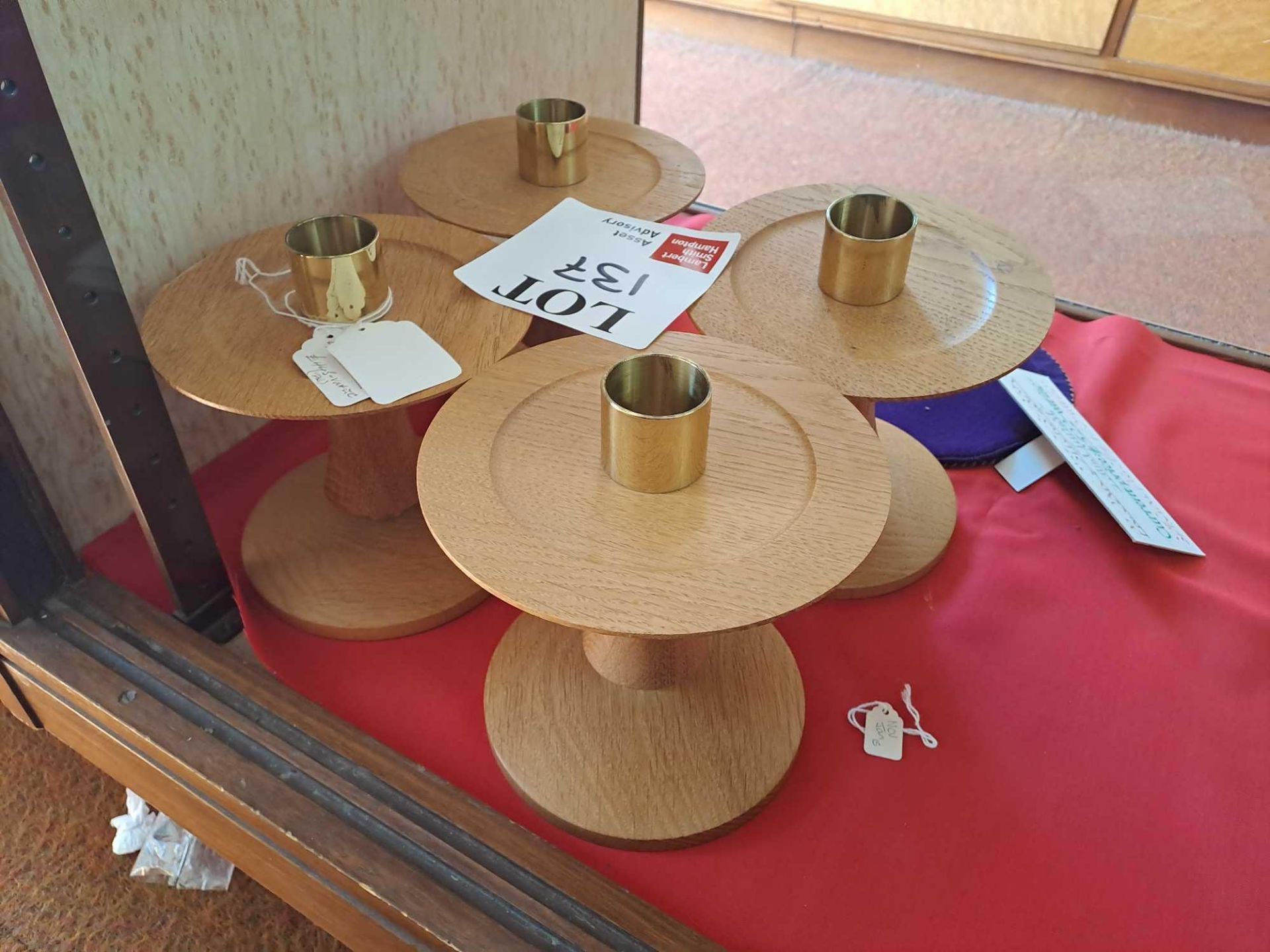Four wooden candlestick holders