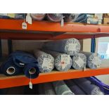 Contents of shelf to include 8 rolls of fabric