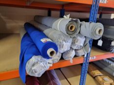 Contents of 2 shelves to include 7 rolls of assorted fabric