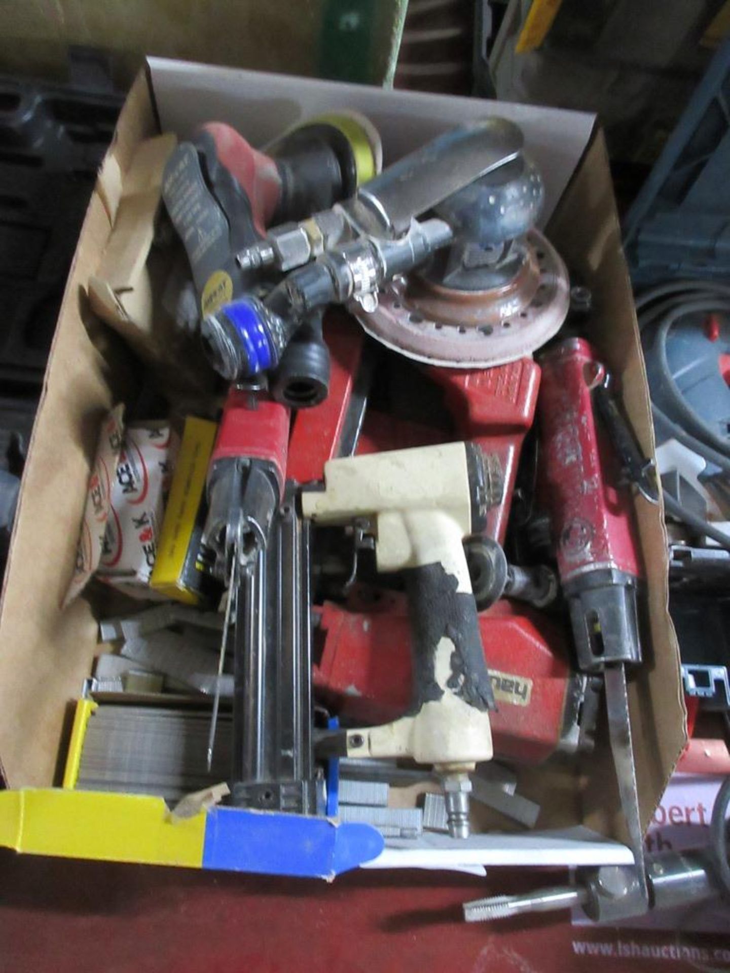 Assorted power tools including orbital sanders, reciprocating saws, nailers etc