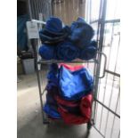 Quantity of assorted size zipped bags and assorted tarpaulin, etc. (excluding cage)