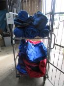 Quantity of assorted size zipped bags and assorted tarpaulin, etc. (excluding cage)
