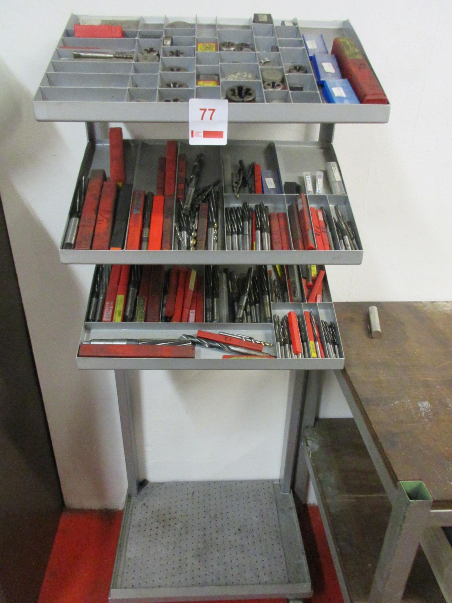 Mobile single sided rack with contents, including taps, dies, reamers, etc.