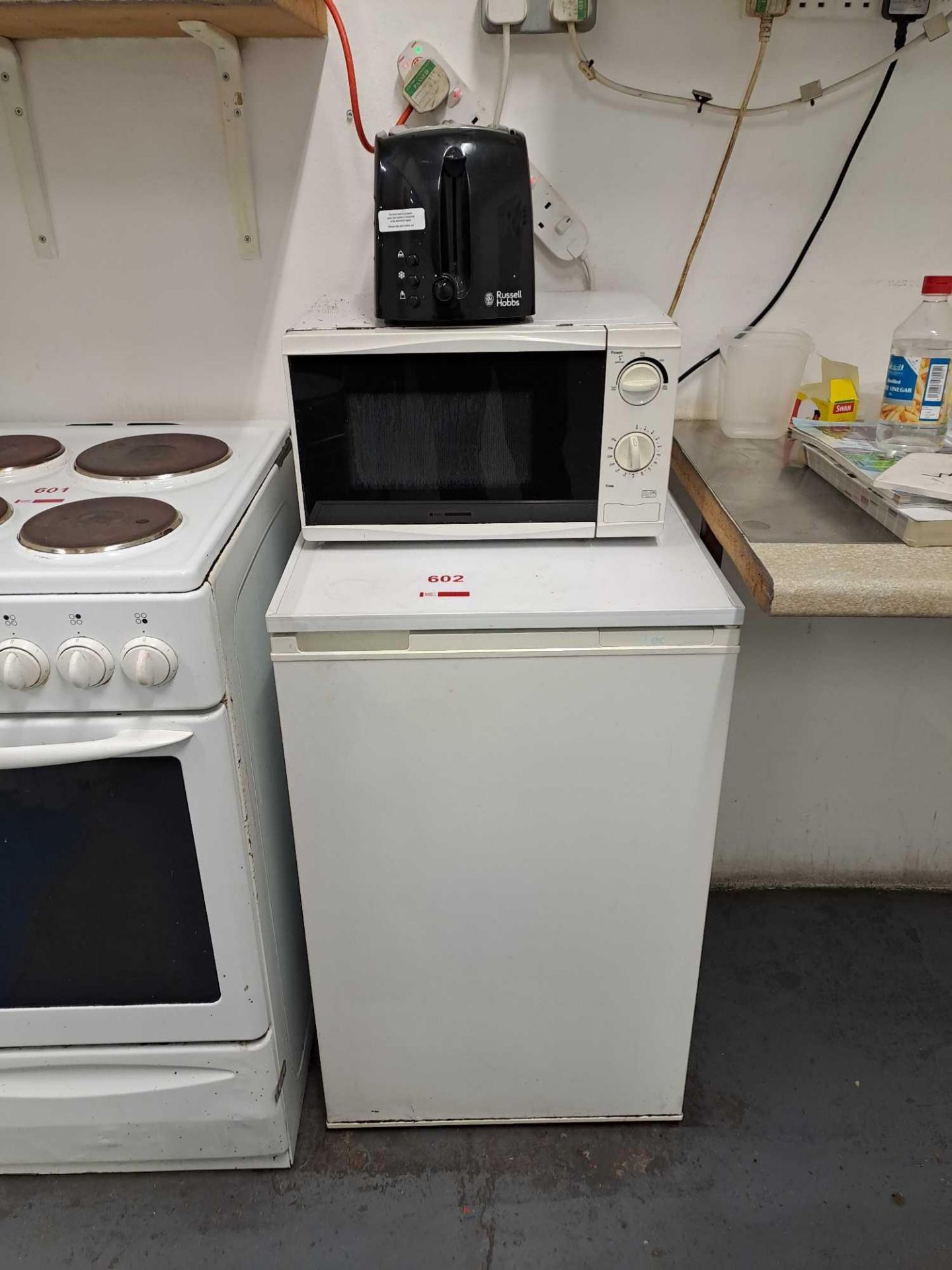 LEC undercounter fridge with Russell Hobbs toaster, and unbranded microwave