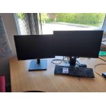 Three assorted monitors, with 2 keyboards and 1 mouse