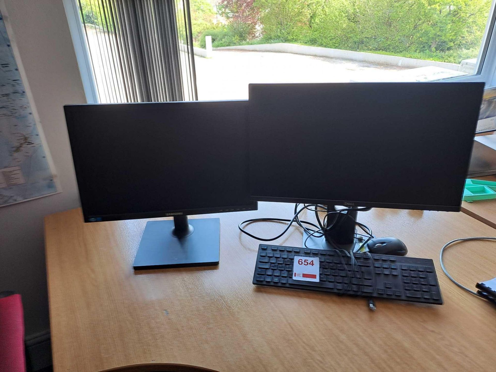 Three assorted monitors, with 2 keyboards and 1 mouse