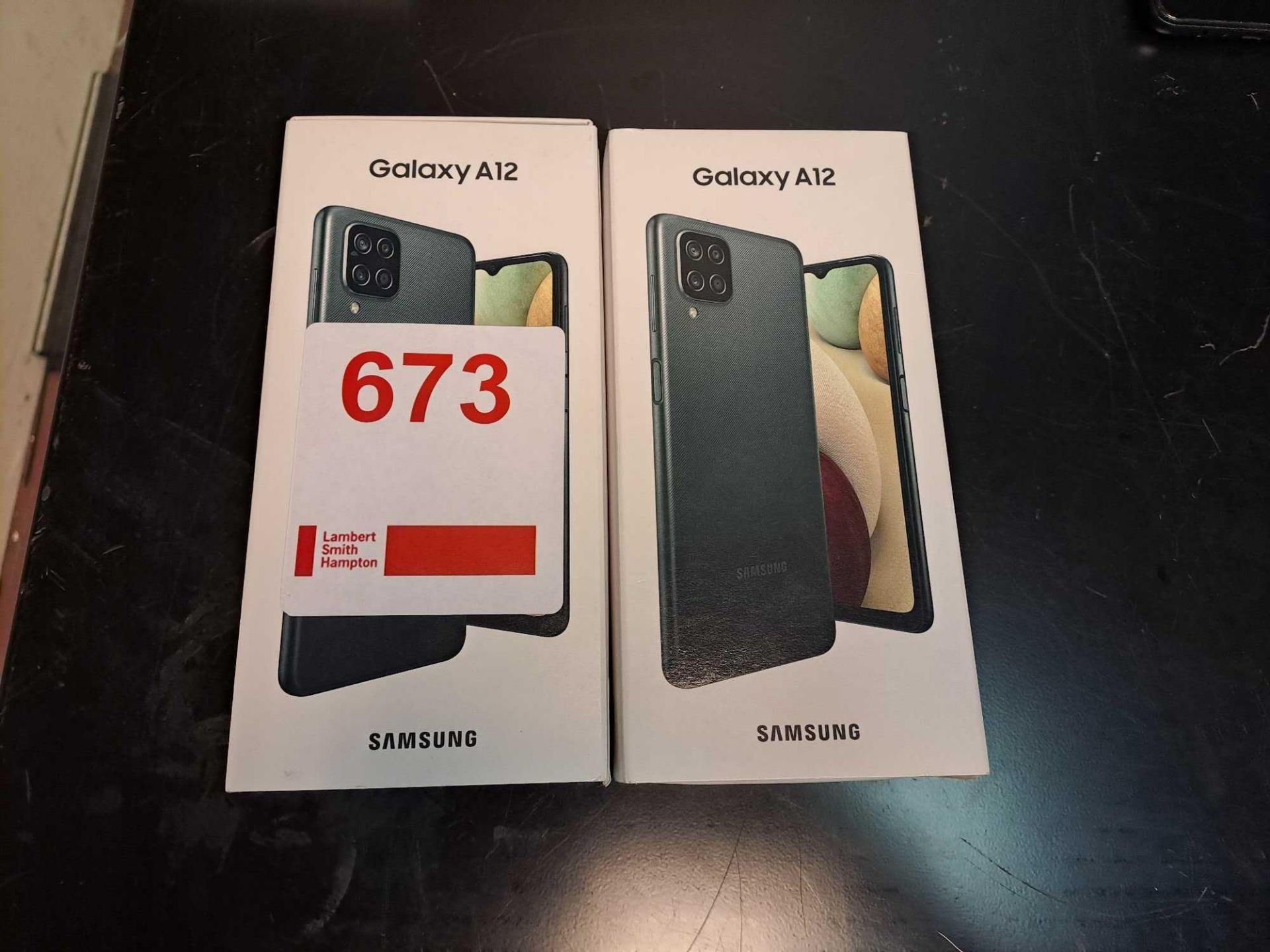 Two Samsung Galaxy A12 phones (boxed, used, no chargers)