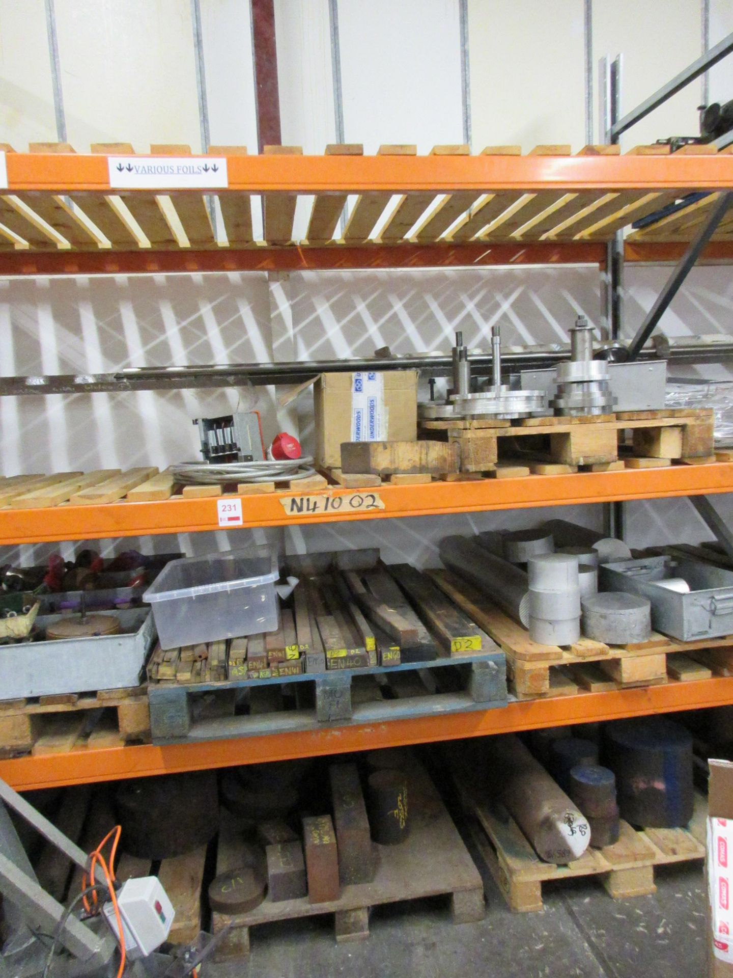 Contents of rack including steel offcuts, various lengths & diamters, machine spares, etc.