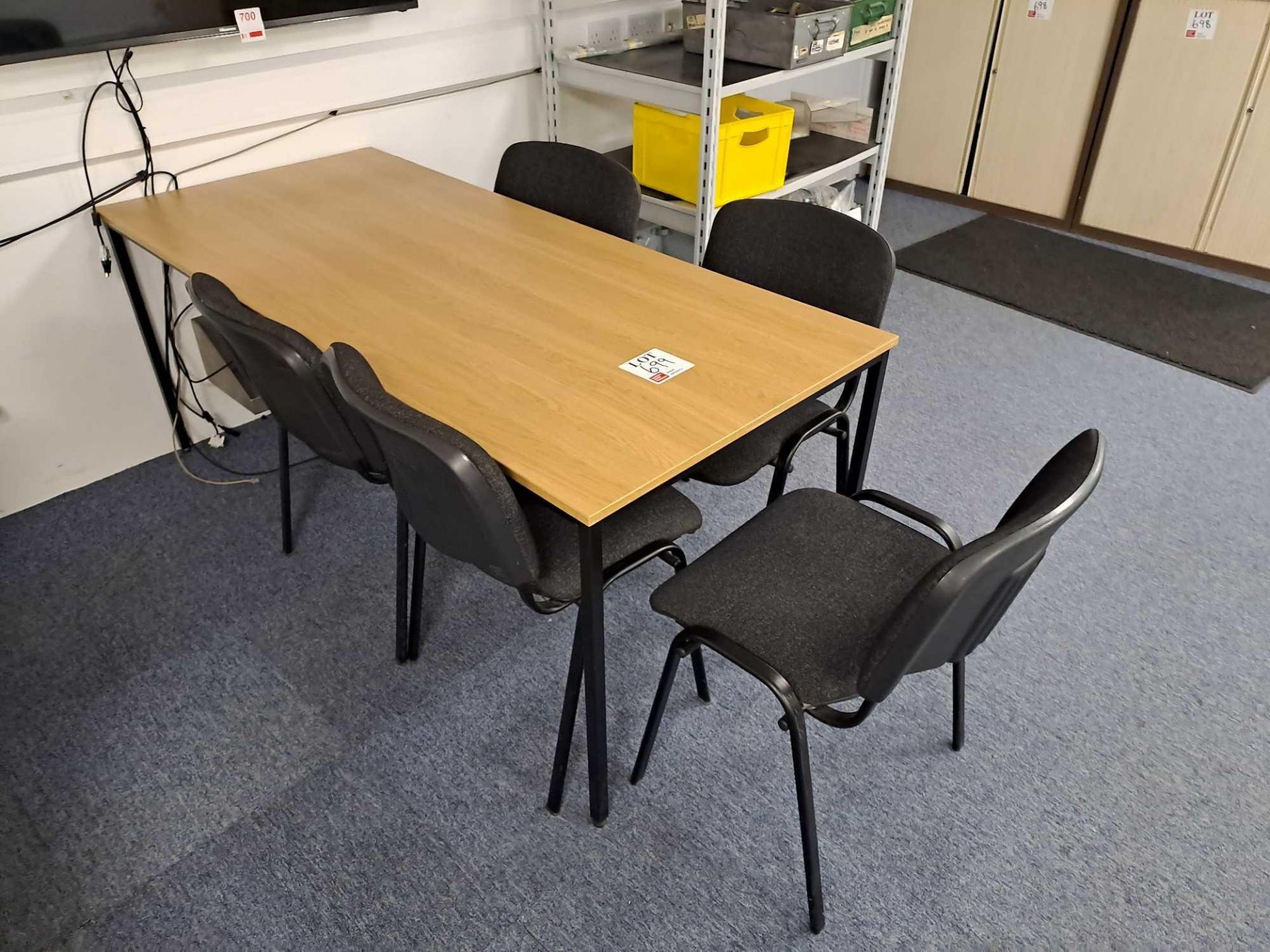 Wood effect table and five black chairs