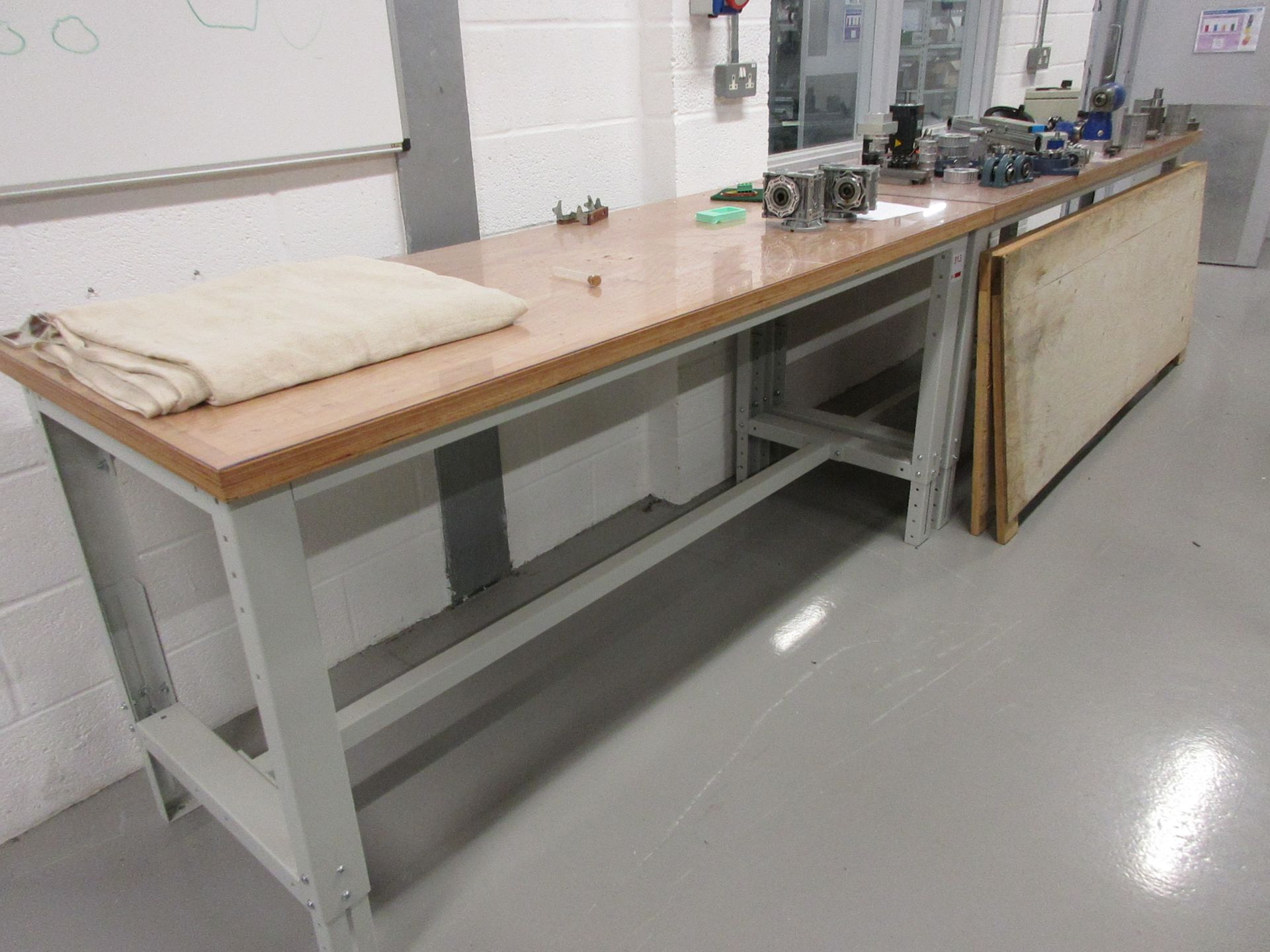 Two metal frame adjustable height workbenches, 2m x 750mm