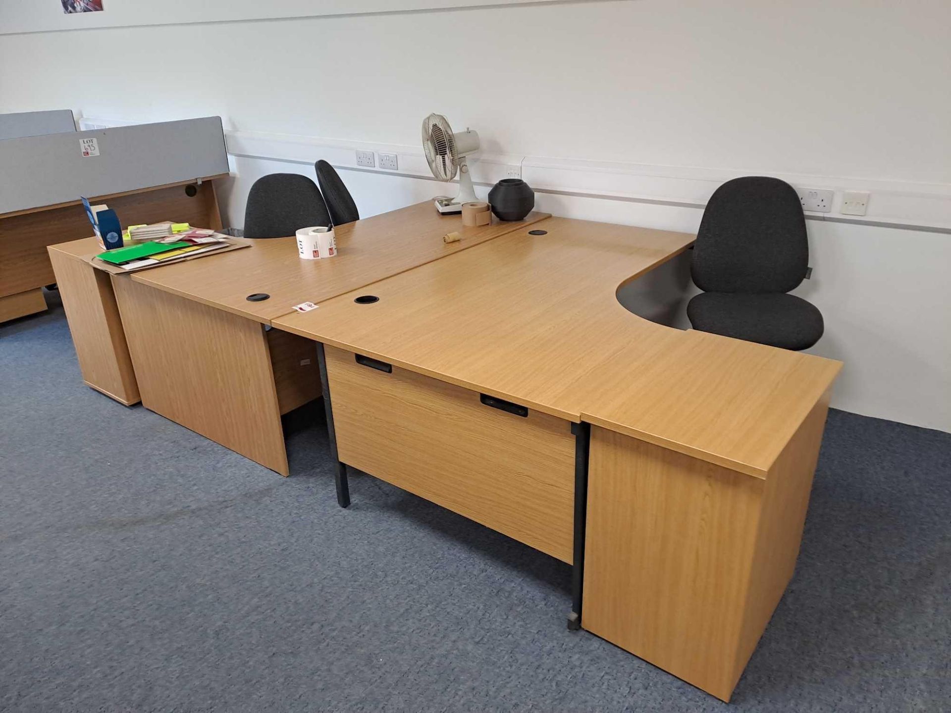 Two wood effect corner desks, two pedestals, three swivel chairs