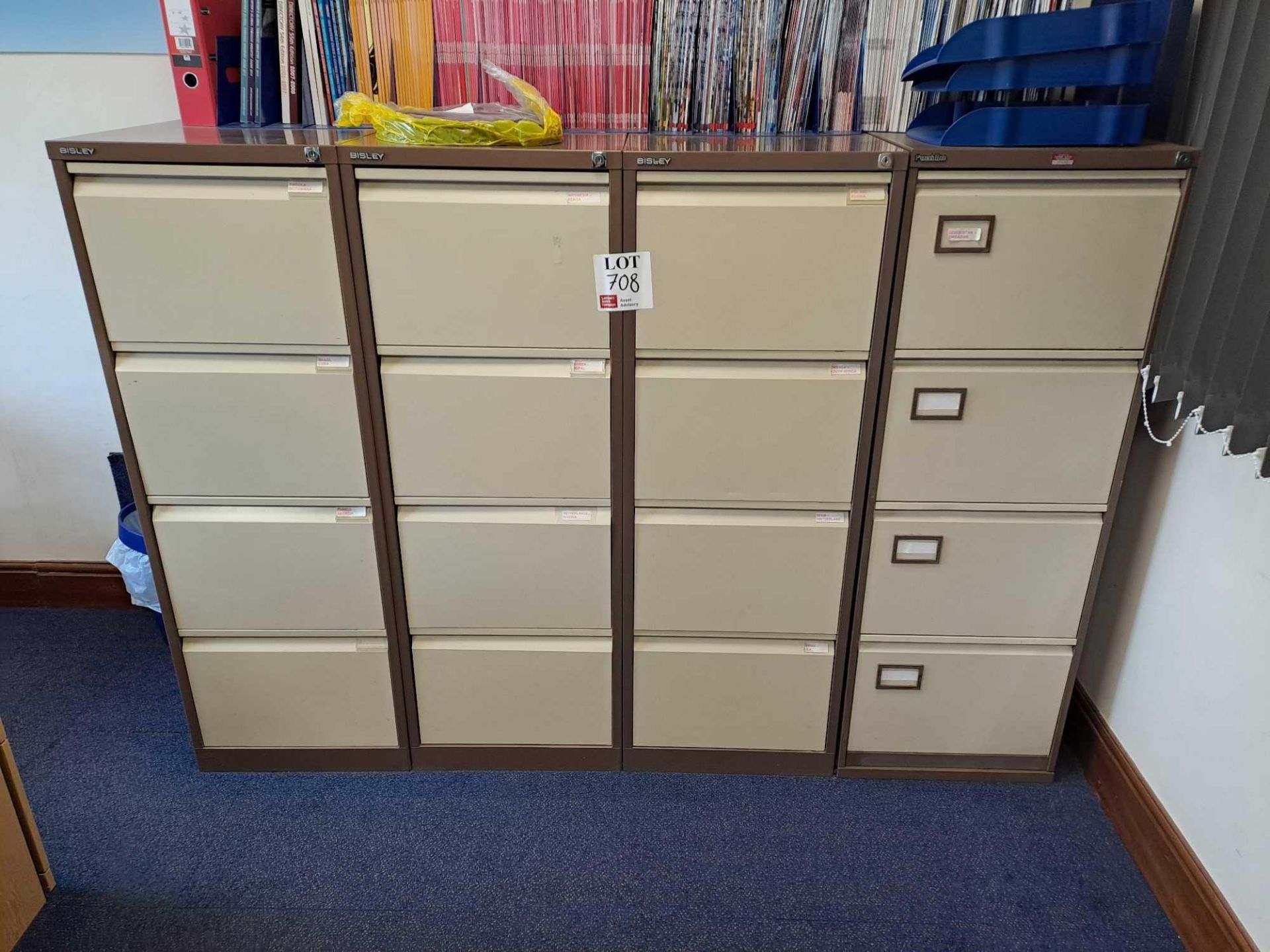 Four 4-drawer Bisley filing cabinets (excluding contents)