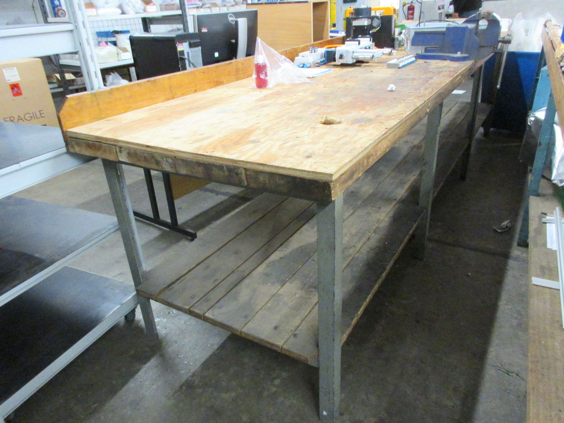 Metal frame/timber top workbench, 3.6m x 930mm with Record No. 23 bench vice, 110mm