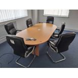 Light wood effect boardroom table with 6 black leather effect chairs