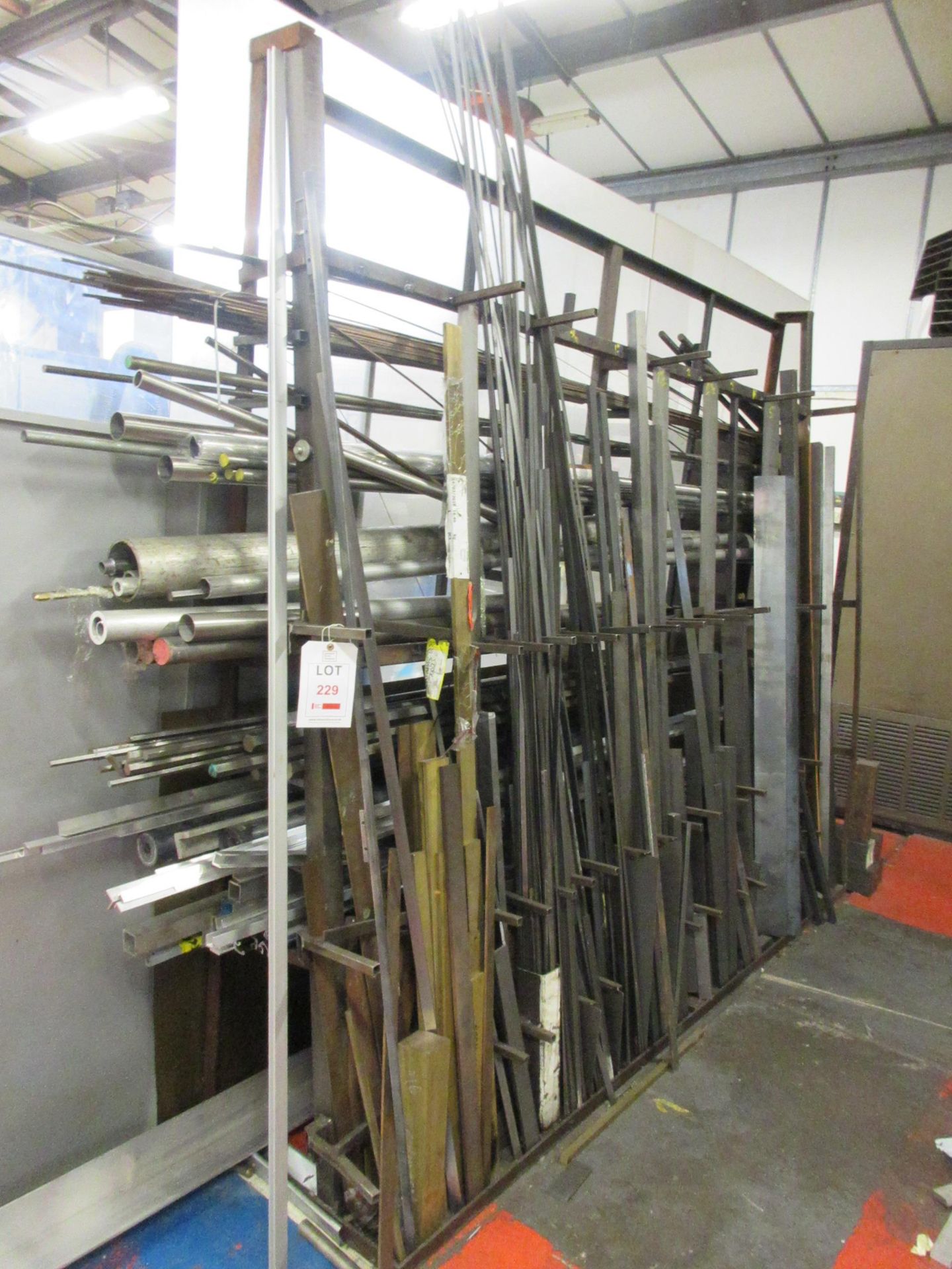 Quantity of assorted steel stock inlcuding angle, bar, flat, box, etc.