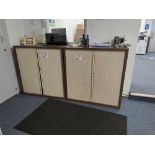 Two double sliding door storage cabinets