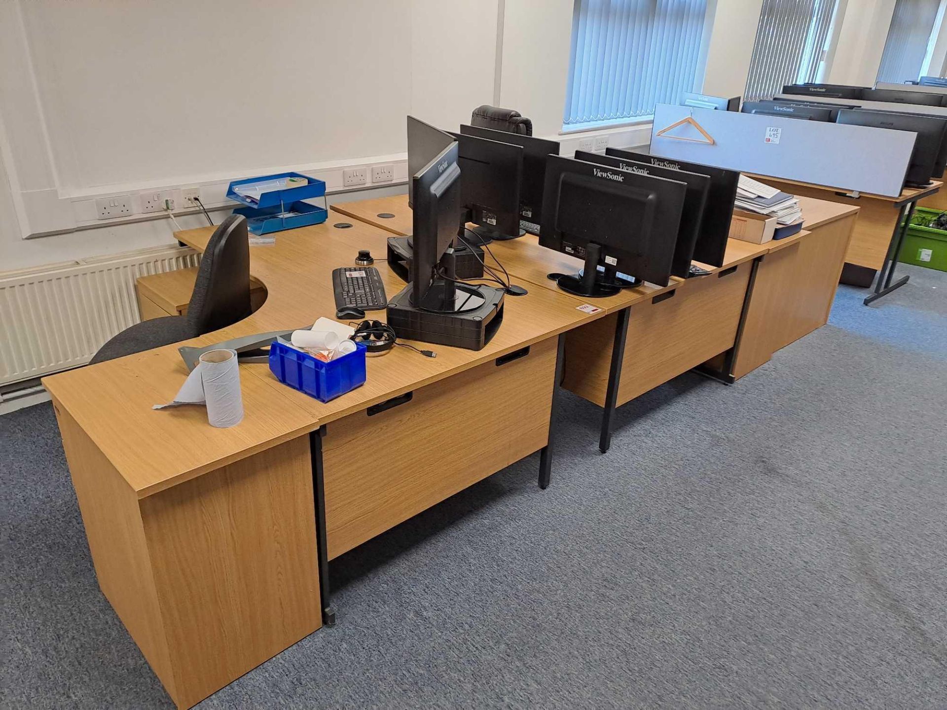 Two wood effect corner desks, two swivel chairs, four pedestals