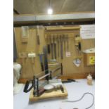 Assorted hand tools including files, hammer, mallet, square, wire baskets, mitre saw, Henry Xtra