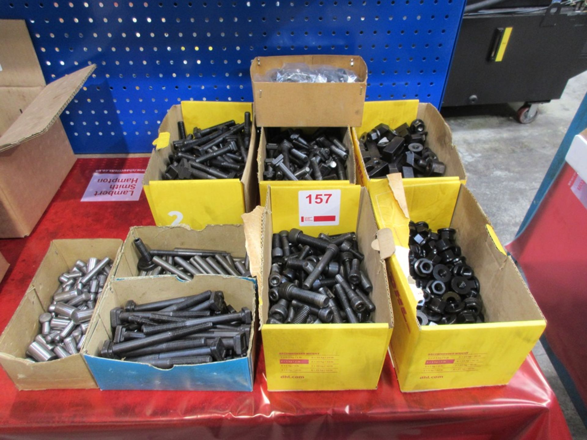 Seven boxes of assorted nuts, bolts & clamps