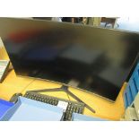 Un-named computer system with Samsung curved screen, keyboard, mouse