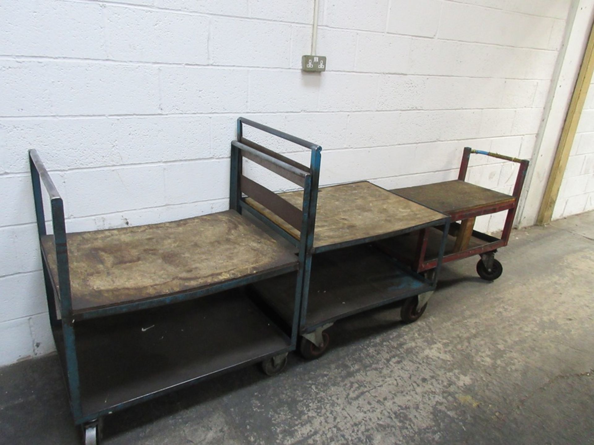 Three assorted metal frame size component trollies