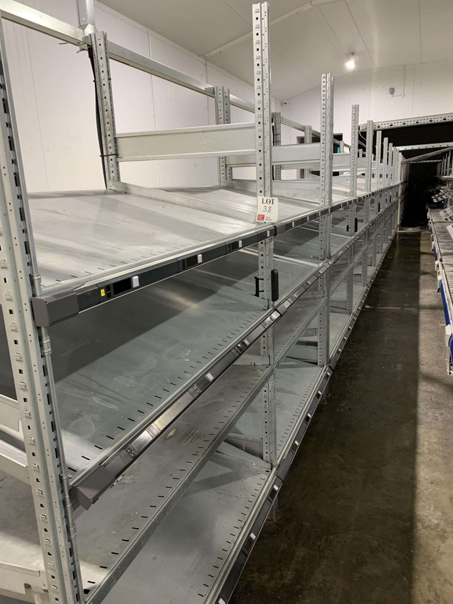 Twenty bays of gravity slide modular racking bays