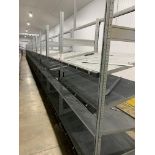 Twenty bays of gravity slide modular racking bays