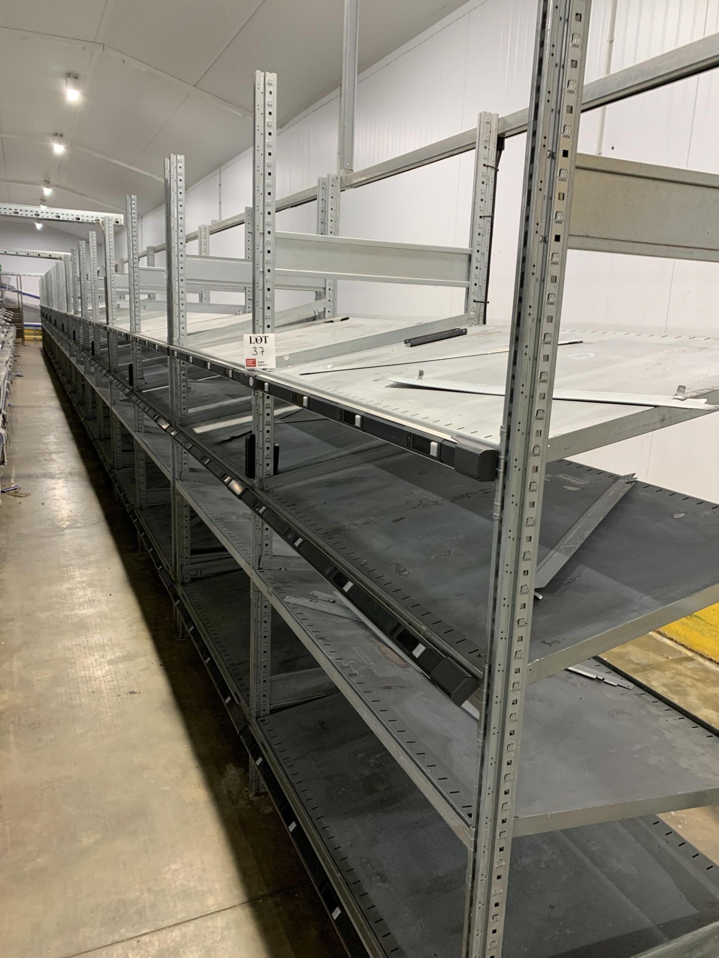 Twenty bays of gravity slide modular racking bays