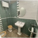Display bathroom to include toilet bowl with overhead cistern, full pedestal sink, radiator and to