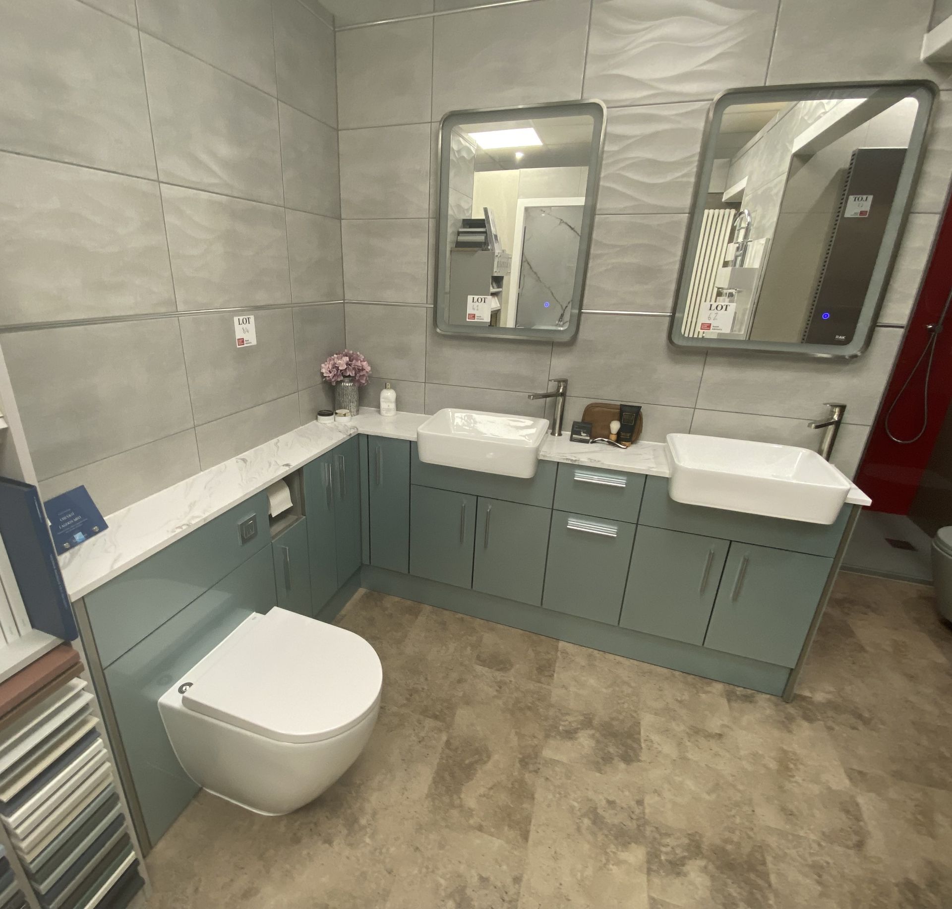 Display bathroom to include toilet, fitted 5 cupboard 2 drawer laminate fronted unit with marble c