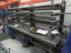 Metal single sided storage rack with contents including various box section, angle, tubing, off