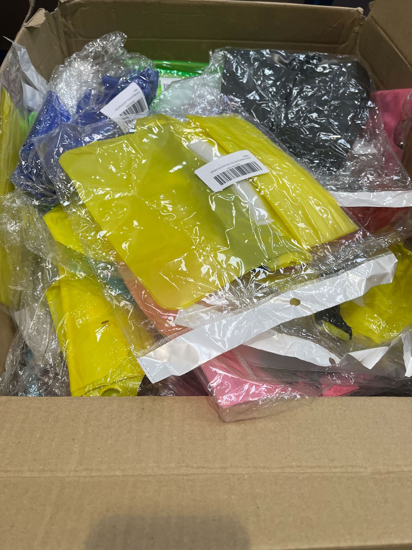 A Box of Various Coloured Waterproof Pouches