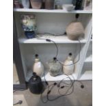 Two Shelves of Various Table Lamps