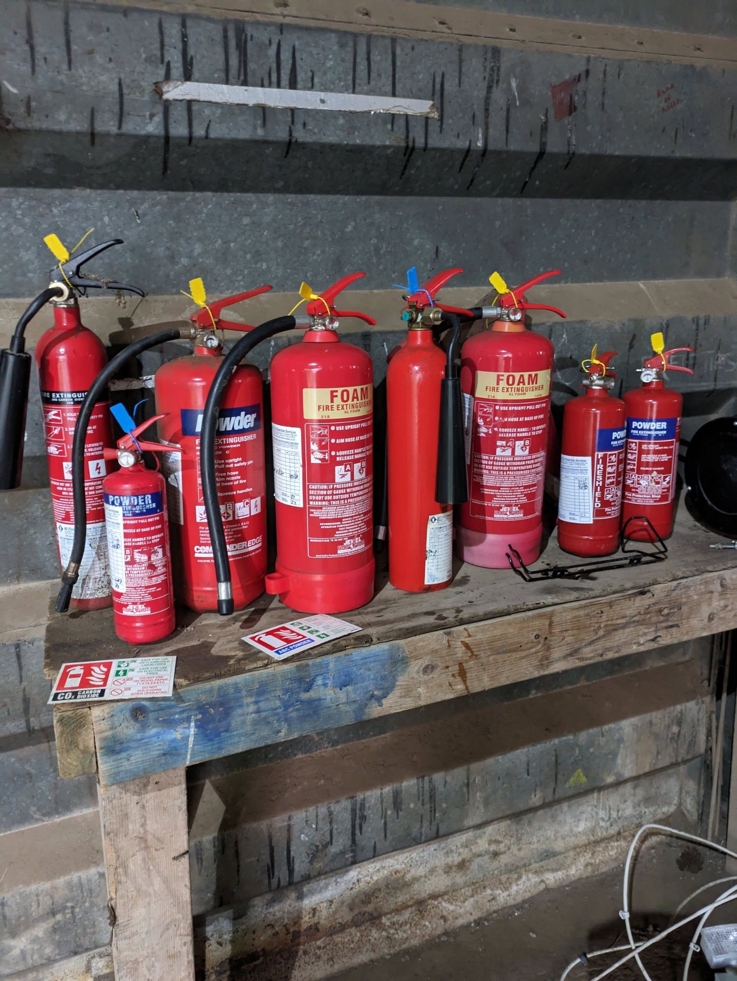 8 various Fire Extinguishers
