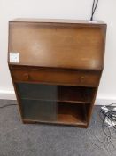 Wooden cabinet with pull down writing desk