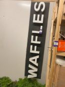 Sign with Extruding Letters Spelling WAFFLES