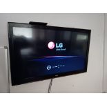 LG 42” Wall Mounted TV with Remote (Buyer to Disconnect & Remove from Wall)