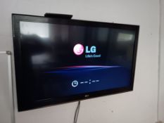 LG 42” Wall Mounted TV with Remote (Buyer to Disconnect & Remove from Wall)