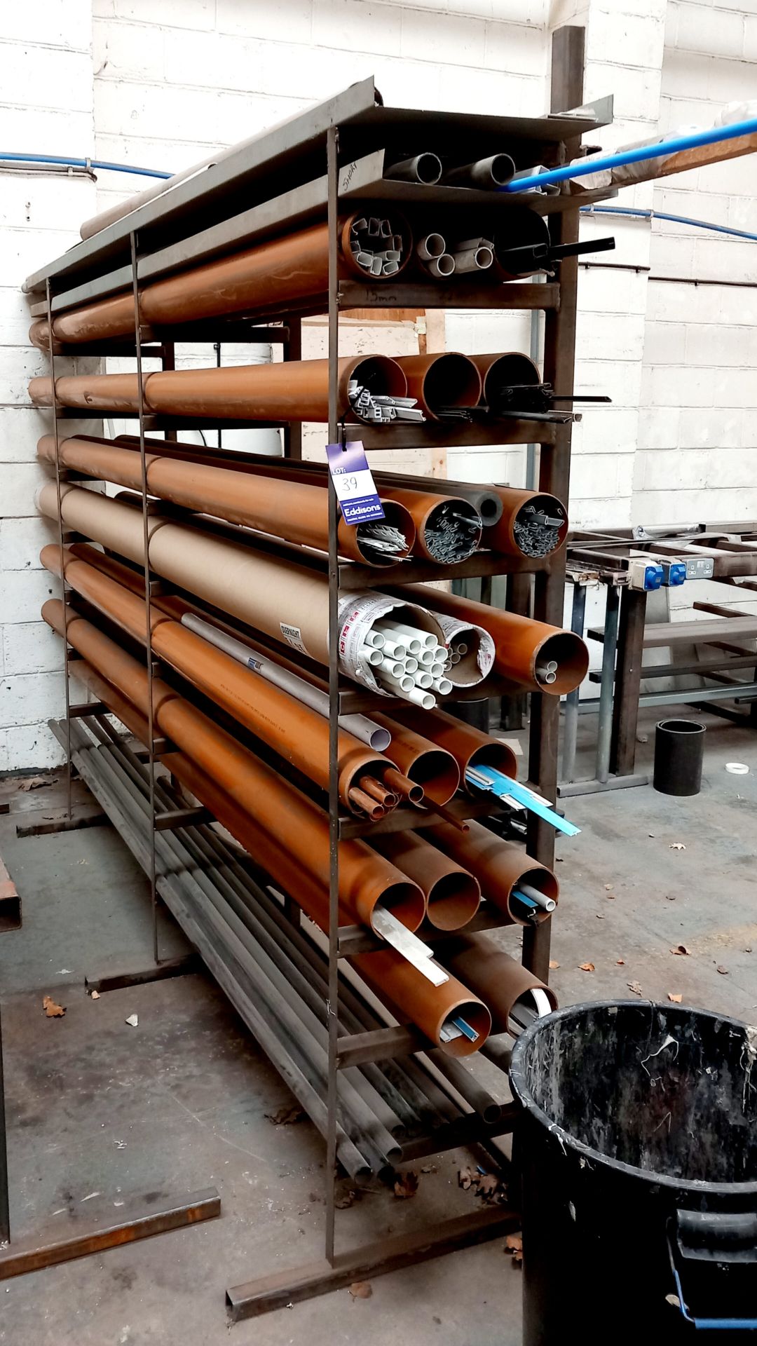 Stock rack and contents of various copper/plastic piping and trim