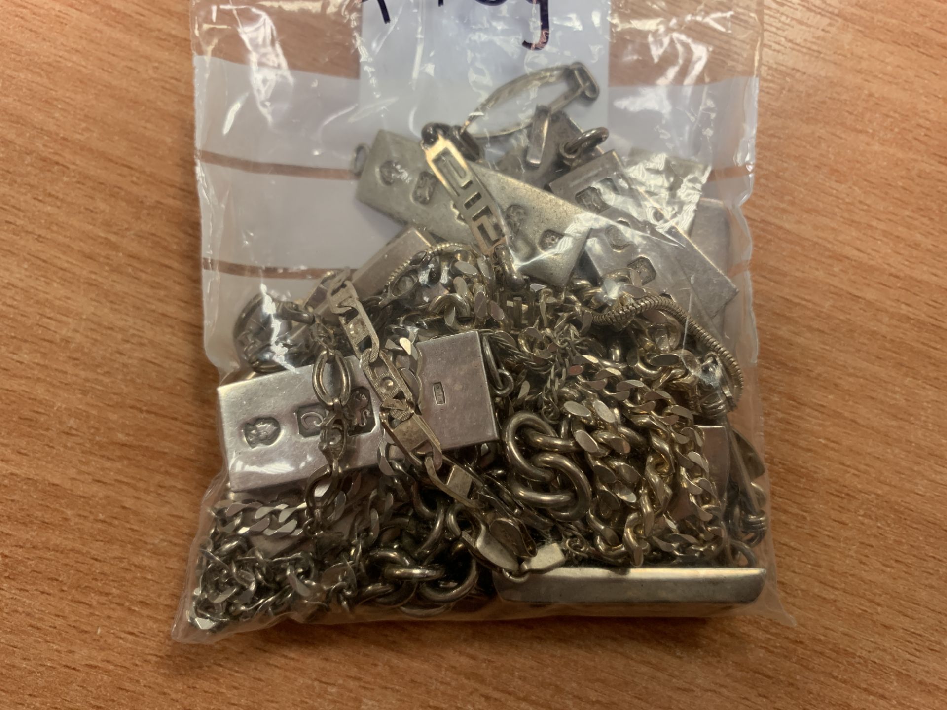Assorted assay stamped silver ingots with '925' stamped chains (total 470g)